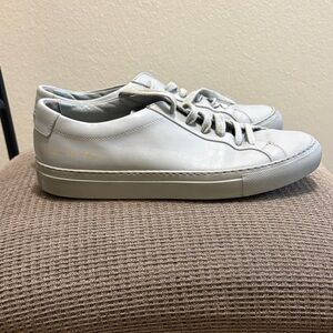 Woman by Common Projects gray shoes